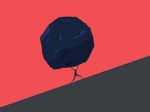 man carrying boulder uphill
